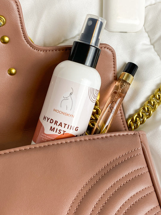 mist bottle popping out of purse